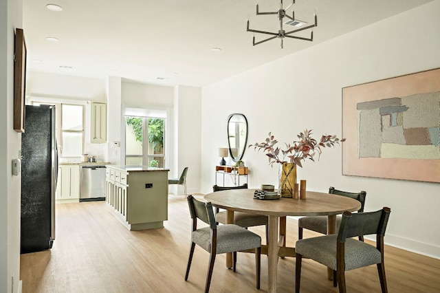 4048 Berkman Dr, Austin, TX 78723 - dining area with light wood-style flooring, baseboards, and recessed lighting