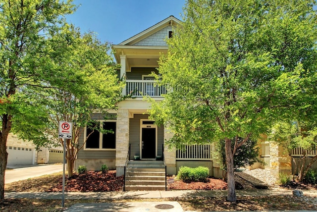 3808 Mattie St, Austin, TX 78723 - view of front facade with a balcony, a porch, and concrete driveway