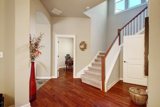 3808 Mattie St, Austin, TX 78723 - foyer entrance with stairs, dark wood-type flooring, and baseboards