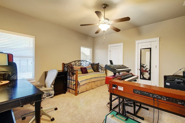 3808 Mattie St, Austin, TX 78723 - bedroom featuring light carpet, a desk, and a ceiling fan