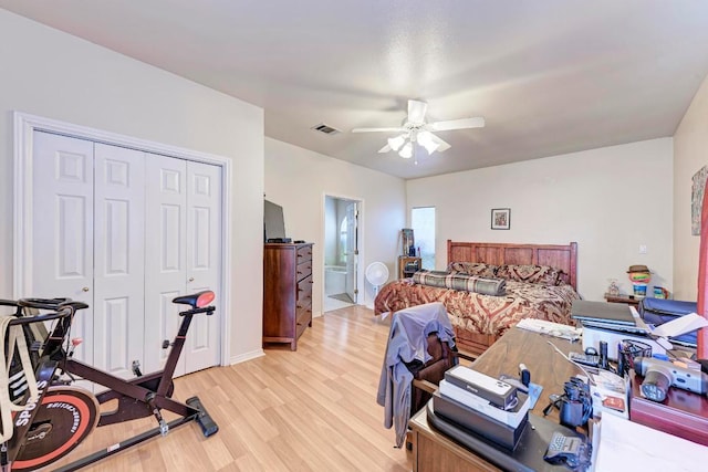 1610 Meadow Ln, Lockhart, TX 78644 - bedroom featuring light wood-style flooring, a closet, ceiling fan, and ensuite bath