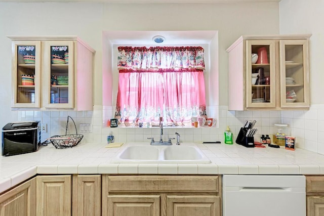 1610 Meadow Ln, Lockhart, TX 78644 - kitchen featuring dishwasher, light brown cabinets, and decorative backsplash