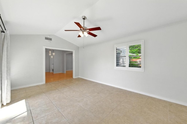 6903 Moonmont Dr, Austin, TX 78745 - unfurnished bedroom with lofted ceiling, light tile patterned flooring, ceiling fan, and baseboards