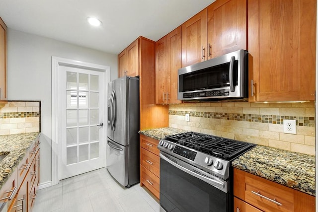 6903 Moonmont Dr, Austin, TX 78745 - kitchen featuring stainless steel appliances, stone countertops, brown cabinets, and recessed lighting