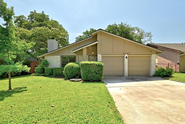 6903 Moonmont Dr, Austin, TX 78745 - mid-century modern home featuring brick siding, an attached garage, concrete driveway, a chimney, and board and batten siding