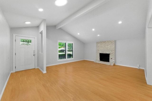 6903 Moonmont Dr, Austin, TX 78745 - unfurnished living room featuring light wood-style floors, baseboards, a brick fireplace, and recessed lighting