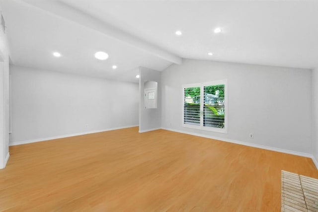 6903 Moonmont Dr, Austin, TX 78745 - spare room featuring light wood-type flooring, baseboards, vaulted ceiling, and recessed lighting