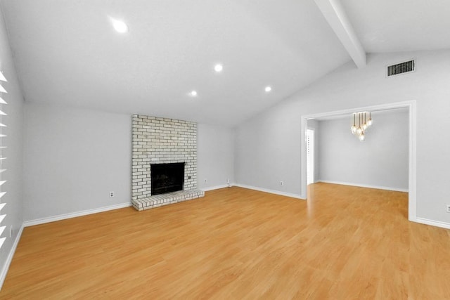 6903 Moonmont Dr, Austin, TX 78745 - unfurnished living room with light wood-type flooring, recessed lighting, a brick fireplace, baseboards, and a chandelier