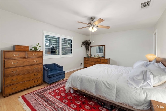 6903 Moonmont Dr, Austin, TX 78745 - bedroom featuring light wood-type flooring, a ceiling fan, and baseboards