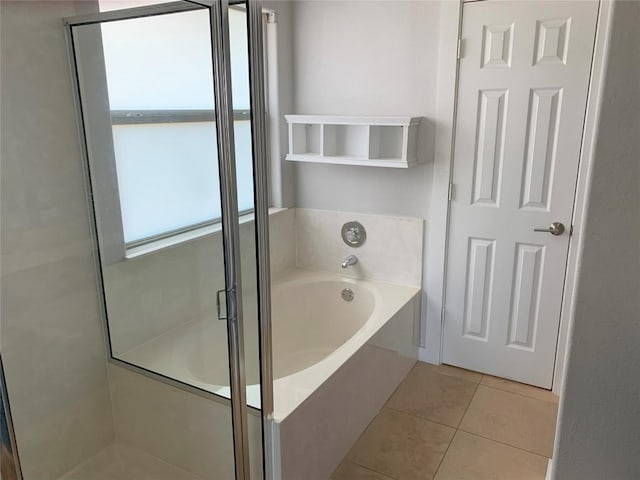 4102 Glendale Ln, Lago Vista, TX 78645 - bathroom featuring a garden tub, a shower stall, and tile patterned floors