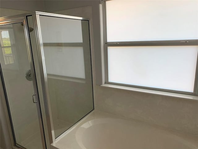 4102 Glendale Ln, Lago Vista, TX 78645 - bathroom featuring a shower stall and a garden tub