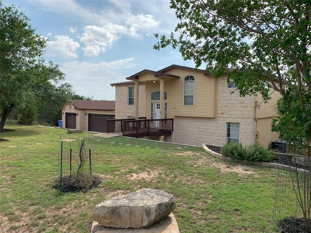 4102 Glendale Ln, Lago Vista, TX 78645 - view of front of home featuring stone siding, a front yard, and an attached garage