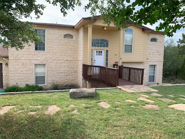 4102 Glendale Ln, Lago Vista, TX 78645 - view of front facade featuring a front yard and stone siding