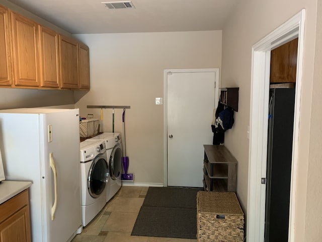 1813 Country Squire Dr, Cedar Park, TX 78613 - washroom with washer and clothes dryer, cabinet space, and light tile patterned floors