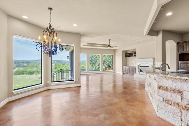 25036 River Rd, Spicewood, TX 78669 - living room featuring baseboards, finished concrete flooring, ceiling fan, a fireplace, and recessed lighting