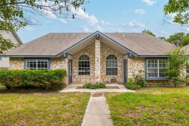 2509 Riddle Rd, Austin, TX 78748 - view of front facade with stone siding and a front yard