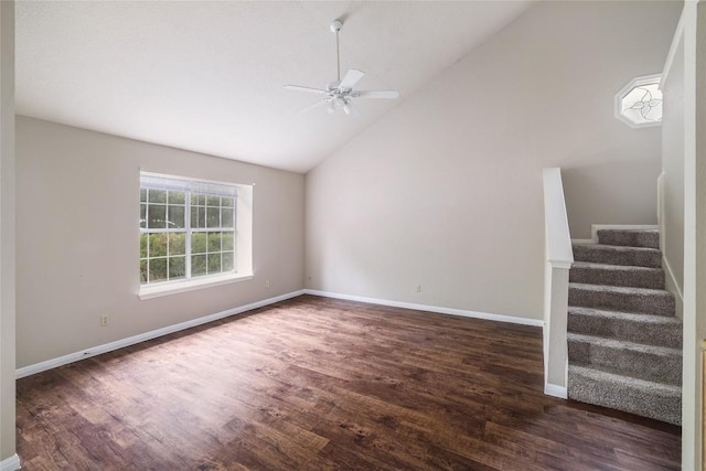 2509 Riddle Rd, Austin, TX 78748 - unfurnished living room featuring wood finished floors, a ceiling fan, stairway, baseboards, and high vaulted ceiling