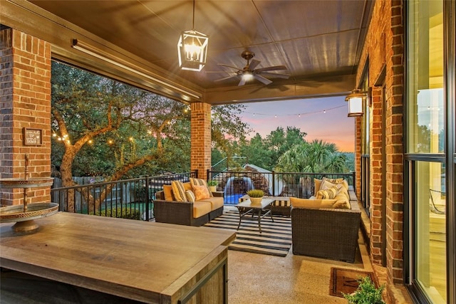 405 Mirafield Ln, Austin, TX 78737 - patio terrace at dusk featuring an outdoor living space, a ceiling fan, and a balcony