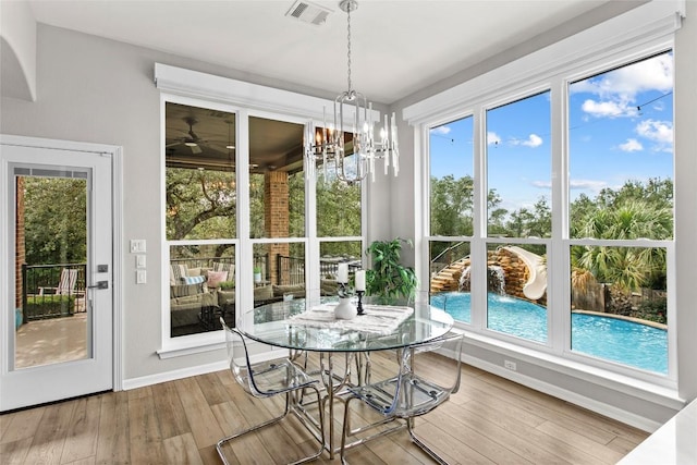 405 Mirafield Ln, Austin, TX 78737 - sunroom / solarium with wood-type flooring and a chandelier