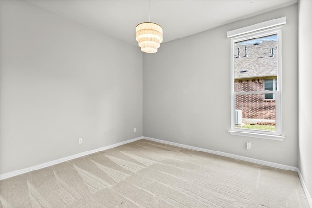 405 Mirafield Ln, Austin, TX 78737 - spare room with light colored carpet, baseboards, and a chandelier