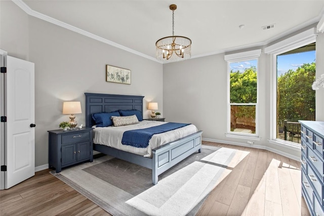 405 Mirafield Ln, Austin, TX 78737 - bedroom with a chandelier, light wood finished floors, crown molding, and baseboards