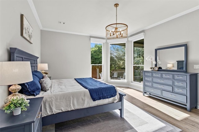 405 Mirafield Ln, Austin, TX 78737 - bedroom featuring wood finished floors, a chandelier, and ornamental molding