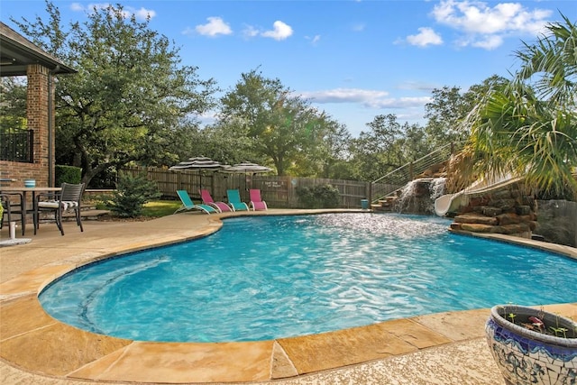 405 Mirafield Ln, Austin, TX 78737 - view of pool with a water slide, a patio area, and a fenced backyard