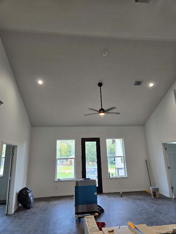 1525 Waco St, Gonzales, TX 78629 - workout area with ceiling fan, baseboards, recessed lighting, and high vaulted ceiling