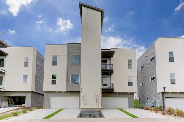 4300 Mansfield Dam Rd Unit 1131, Austin, TX 78734 - view of apartment building / complex featuring an attached garage and concrete driveway