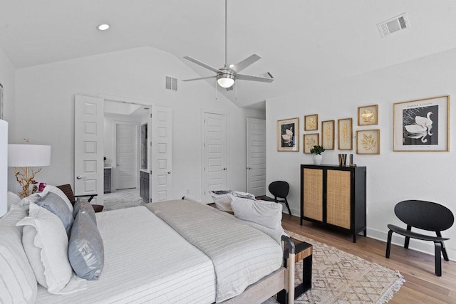5324 Agatha Cir, Austin, TX 78724 - bedroom featuring lofted ceiling, light wood-style floors, a ceiling fan, and ensuite bathroom