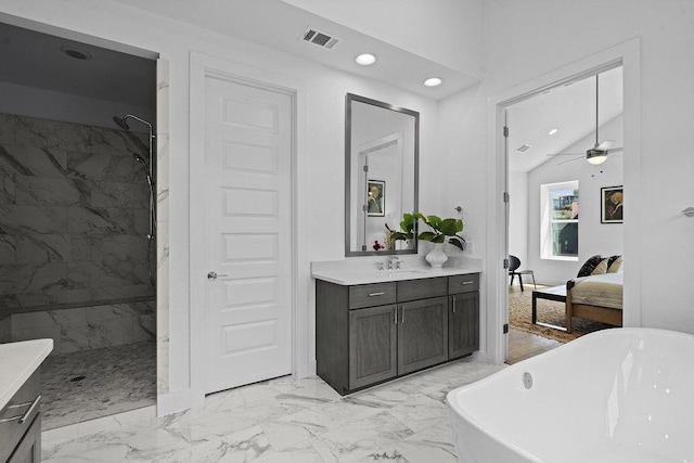 5324 Agatha Cir, Austin, TX 78724 - ensuite bathroom featuring marble finish flooring, vanity, a freestanding bath, a marble finish shower, and recessed lighting