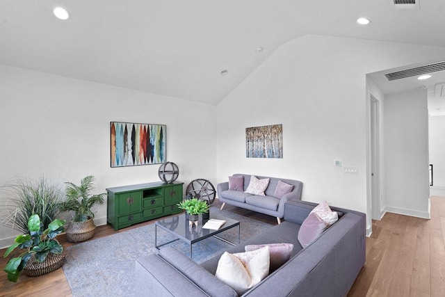 5324 Agatha Cir, Austin, TX 78724 - living area featuring vaulted ceiling, wood finished floors, recessed lighting, and baseboards