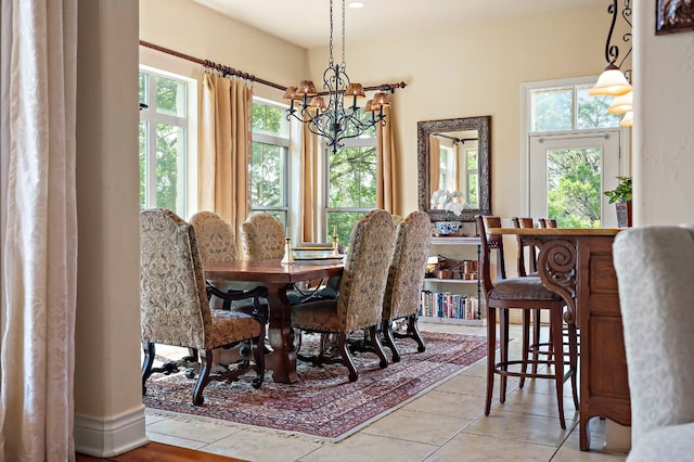 1607 The High Rd, Austin, TX 78746 - dining space featuring a chandelier and tile patterned floors