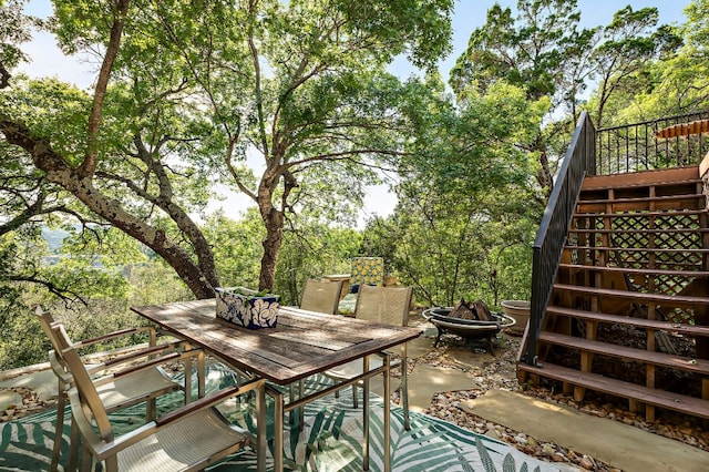 1607 The High Rd, Austin, TX 78746 - view of patio / terrace with stairway, outdoor dining area, and an outdoor fire pit