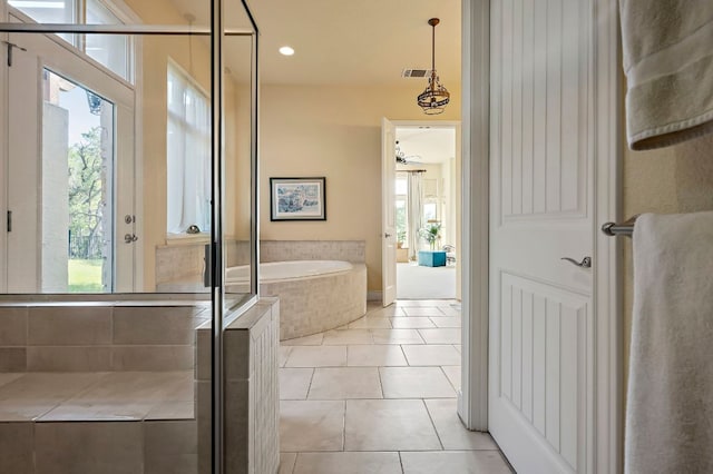 1607 The High Rd, Austin, TX 78746 - full bath featuring a garden tub, tile patterned flooring, and a ceiling fan