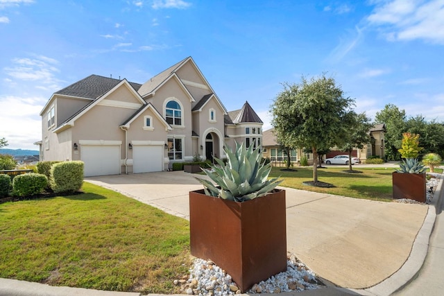 2329 Sandorna Ct, Leander, TX 78641 - traditional-style house featuring concrete driveway, a front lawn, stucco siding, and a garage