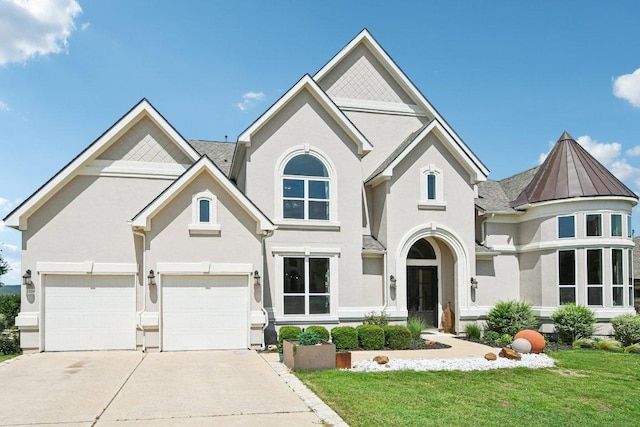 2329 Sandorna Ct, Leander, TX 78641 - view of front of house featuring stucco siding, a front yard, and an attached garage