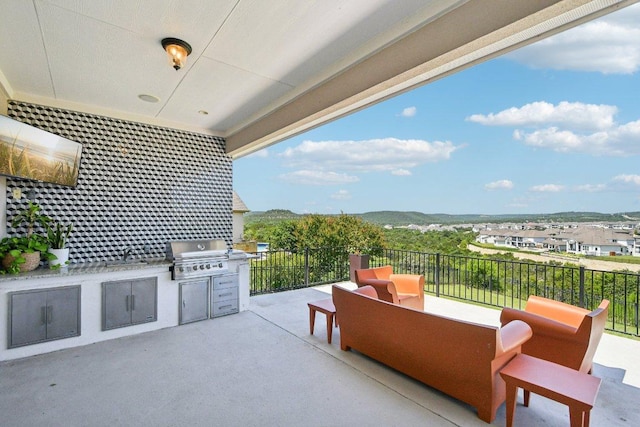 2329 Sandorna Ct, Leander, TX 78641 - view of patio featuring an outdoor kitchen and a sink