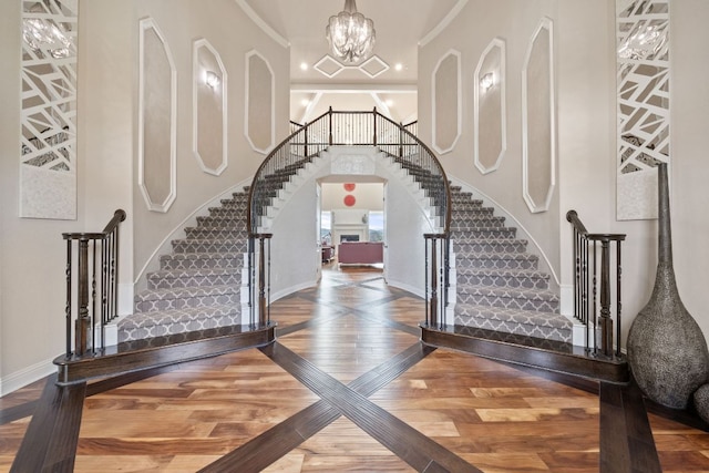2329 Sandorna Ct, Leander, TX 78641 - foyer with stairs, wood finished floors, and a chandelier