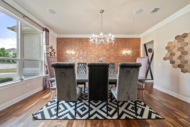 2329 Sandorna Ct, Leander, TX 78641 - dining space with a chandelier, healthy amount of natural light, wood finished floors, and ornamental molding