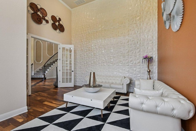 2329 Sandorna Ct, Leander, TX 78641 - living room with wood finished floors, stairway, and ornamental molding