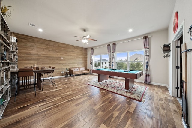 2329 Sandorna Ct, Leander, TX 78641 - game room with wood walls, a ceiling fan, wood finished floors, a fireplace, and billiards