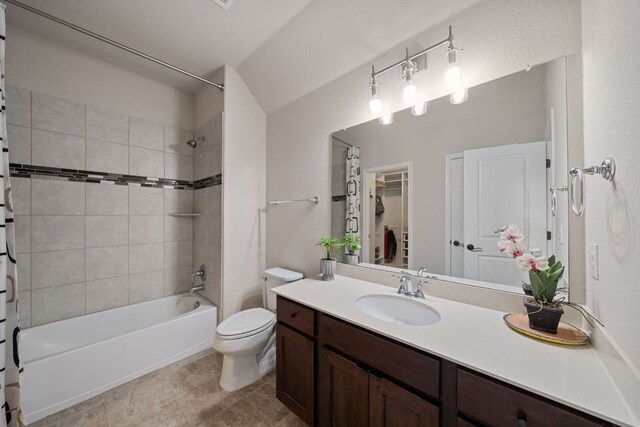 2329 Sandorna Ct, Leander, TX 78641 - bathroom with shower / bath combo with shower curtain, vanity, tile patterned floors, and a walk in closet