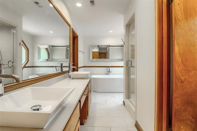213 Hurst Creek Rd, Austin, TX 78734 - bathroom featuring a freestanding bath, double vanity, recessed lighting, and a stall shower