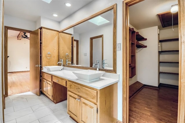213 Hurst Creek Rd, Austin, TX 78734 - full bathroom with double vanity, wood finished floors, and a spacious closet
