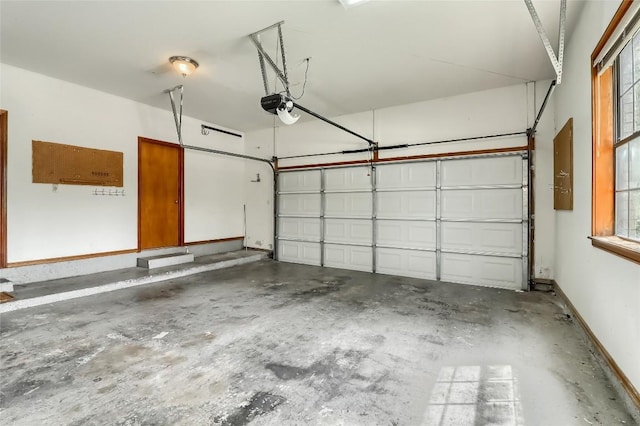 213 Hurst Creek Rd, Austin, TX 78734 - garage featuring a garage door opener and baseboards