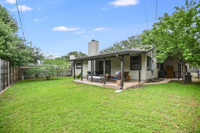 7000 Shadywood Dr, Austin, TX 78745 - back of property featuring a fenced backyard, a chimney, and a patio