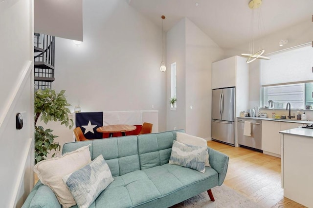913 Duncan Ln Unit 103, Austin, TX 78705 - living area with light wood finished floors and vaulted ceiling