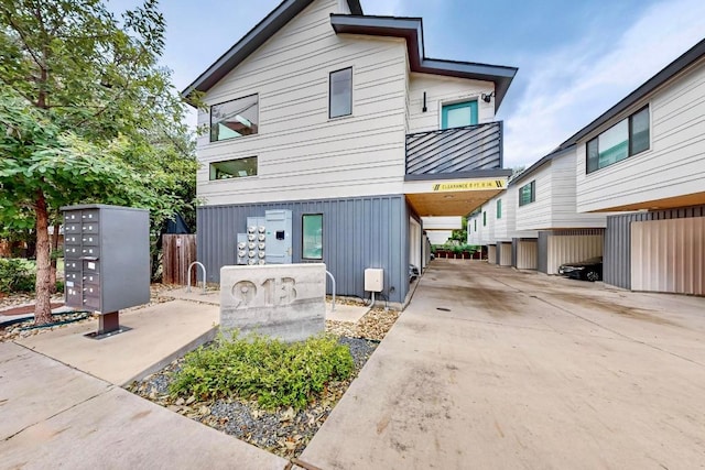 913 Duncan Ln Unit 103, Austin, TX 78705 - view of front of home with a standing seam roof and metal roof