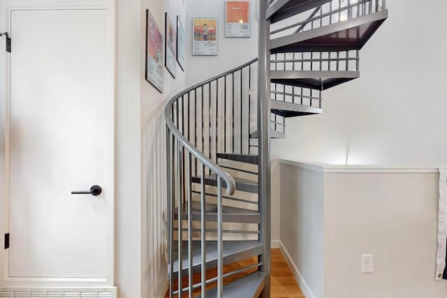 913 Duncan Ln Unit 103, Austin, TX 78705 - staircase with wood finished floors and baseboards